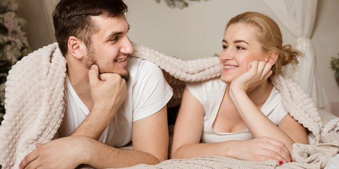 Beautiful young man and woman smiling