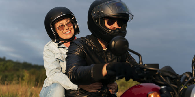 Side view people with motorbike outdoors